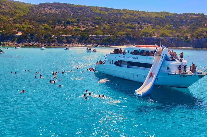 Blue Lagoon (Akamas) Bus & Boat Tour with Water Slide From Paphos - Fruit, drinks, and the ride back to Latchi