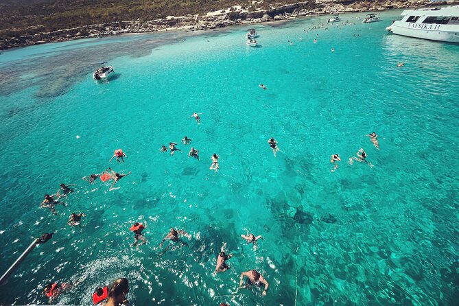Blue Lagoon trip with slide & music departing from Latchi harbour - Drinks, fruit, music, and the onboard atmosphere