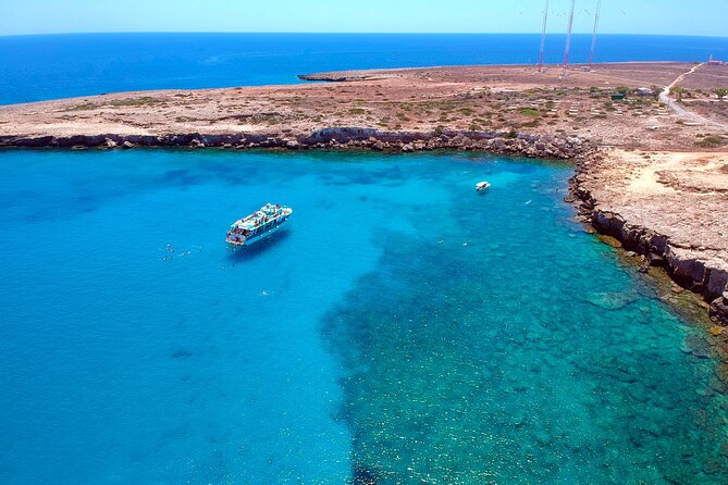 Sea caves and clear water on the coast at Cape Greco